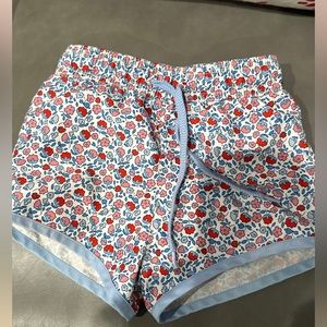 Minnow boys swim trunks. Red, white and blue floral. Boardies.